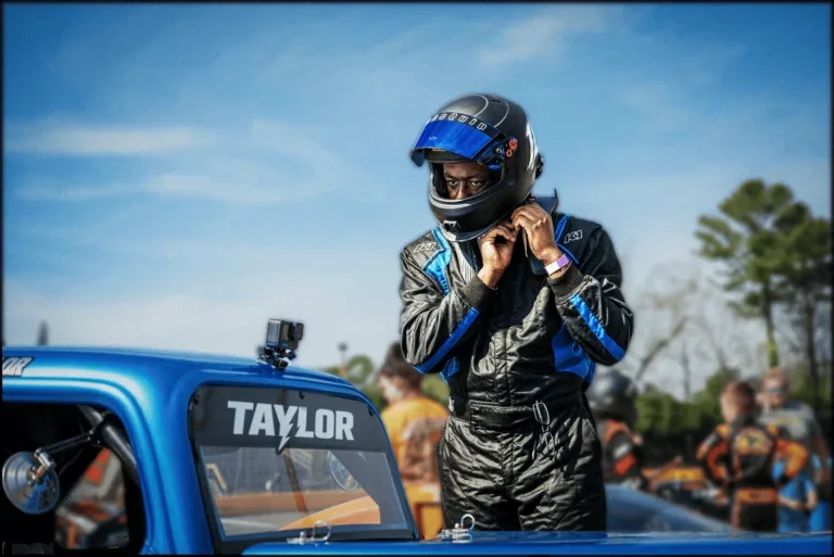 Jay Taylor beside his race car
